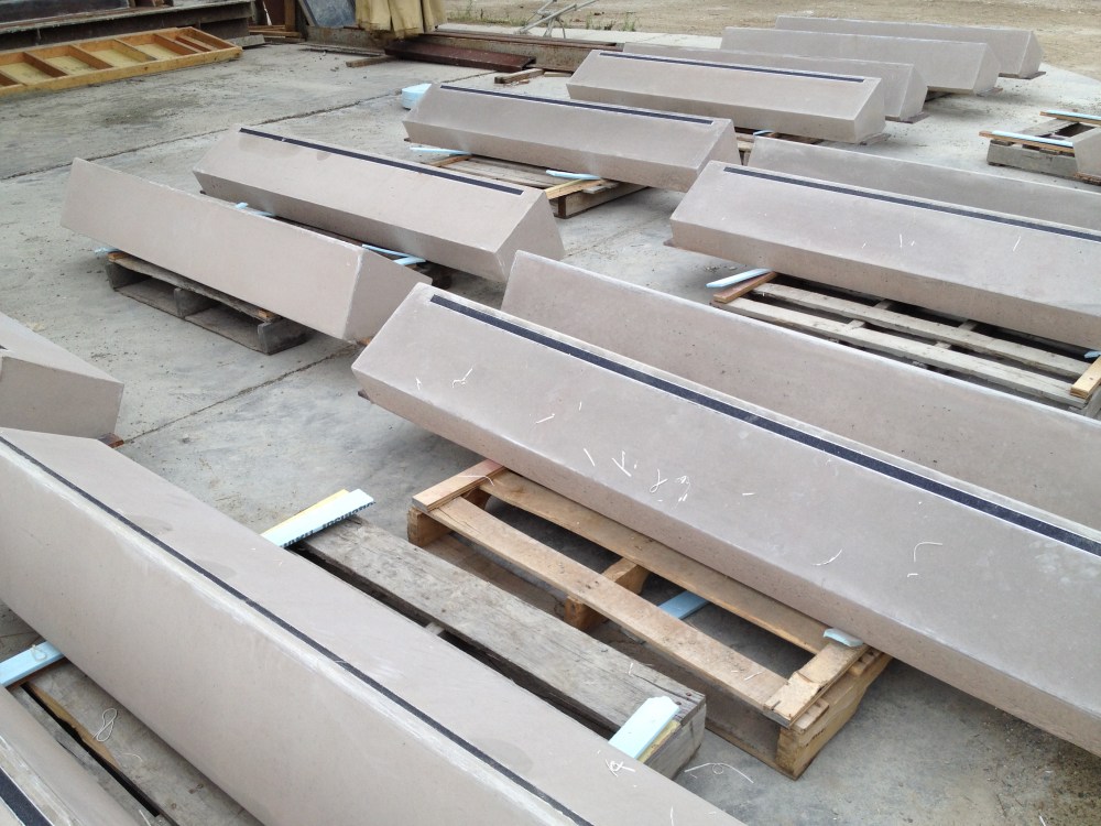 Finished precast sills on pallets in the yard