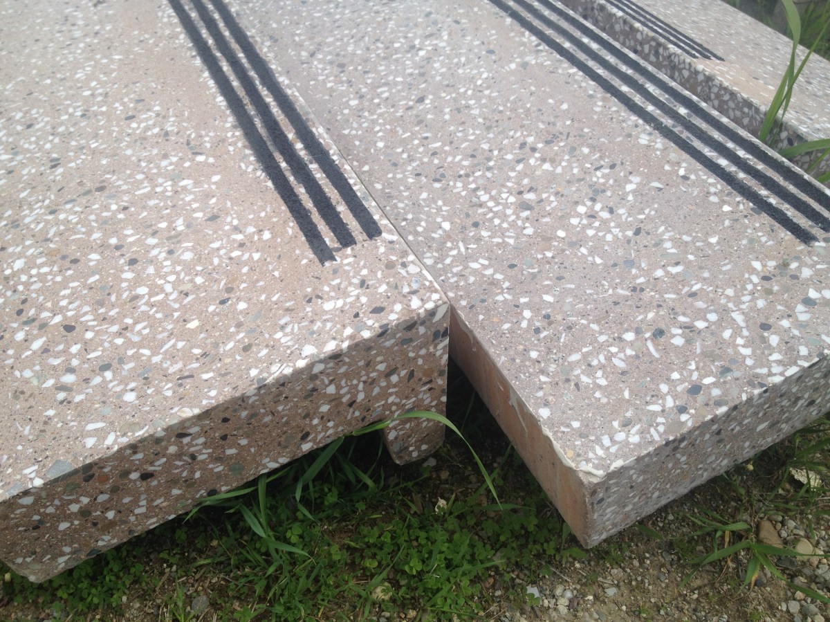 Precast stair treads with abrasive nosing strips