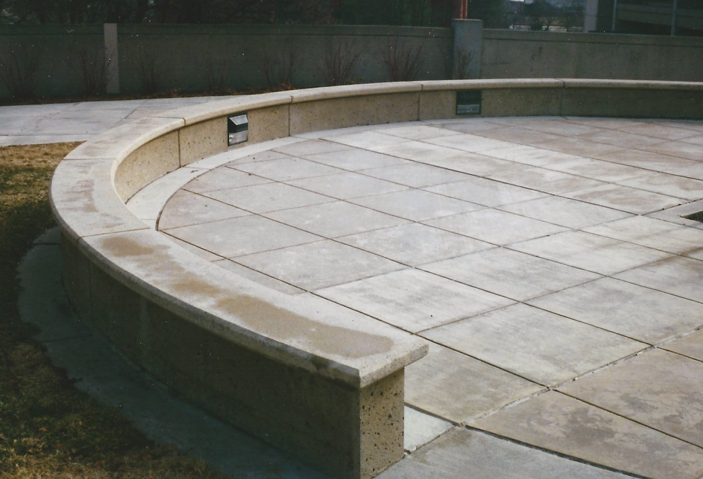 Curved precast seat wall around a plaza